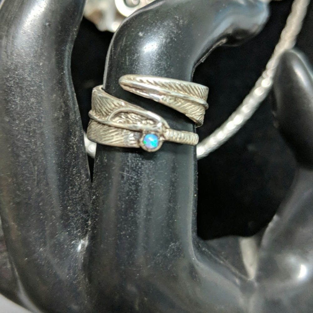 Sweet sterling silver feather wrap around ring.